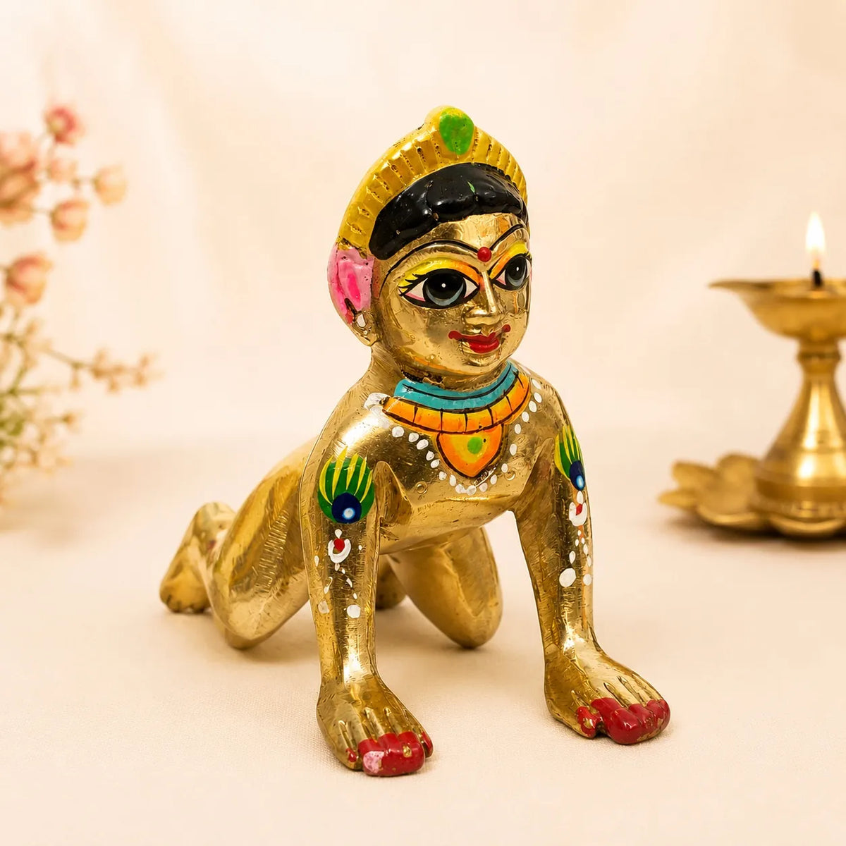 Close-up of hand-painted detailing on Brass Radha Rani Murti