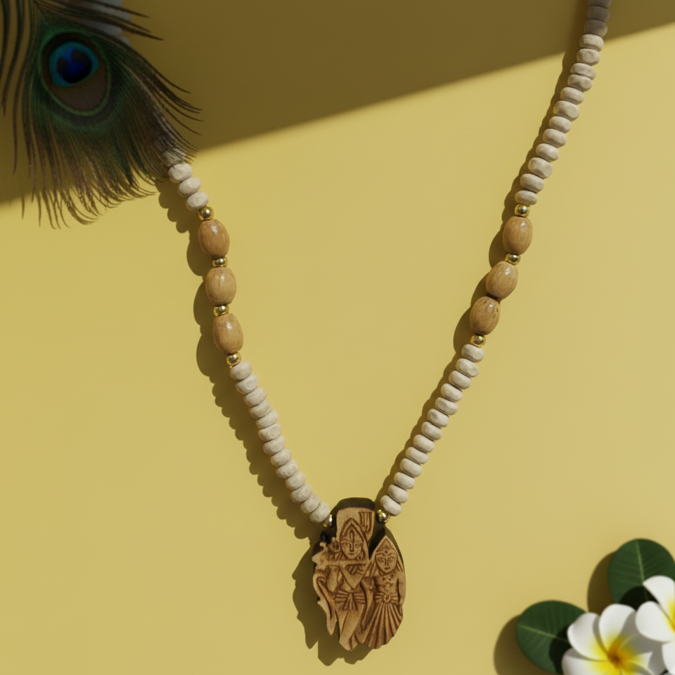Necklace with wooden pendant and beads on a yellow background with peacock feather and flowers.